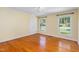 Bedroom with hardwood floors, neutral walls, and large windows showcasing natural light at 417 N Gurney St, Burlington, NC 27215