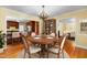 Elegant dining room featuring hardwood floors and views of the kitchen and living room at 417 N Gurney St, Burlington, NC 27215