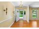 Inviting foyer featuring hardwood floors, chandelier, and view of the front yard at 417 N Gurney St, Burlington, NC 27215