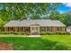 Charming brick home with manicured lawn and mature landscaping at 417 N Gurney St, Burlington, NC 27215