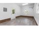 Clean garage space with brick foundation and new vinyl flooring at 417 N Gurney St, Burlington, NC 27215