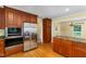 Kitchen featuring stainless steel appliances, custom cabinetry, and granite countertops at 417 N Gurney St, Burlington, NC 27215