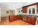 Beautiful kitchen with wood cabinets, granite countertops, and stainless steel appliances at 417 N Gurney St, Burlington, NC 27215