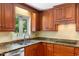 Close-up of a kitchen showcasing granite countertops, stainless steel appliances, and custom cabinets at 417 N Gurney St, Burlington, NC 27215
