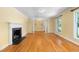 Spacious living room with fireplace, hardwood floors, and natural light at 417 N Gurney St, Burlington, NC 27215