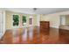 Spacious living room with hardwood floors, natural light, and built-in bar at 417 N Gurney St, Burlington, NC 27215