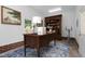 Bright home office featuring a desk, bookcase, and a view of the outdoors at 417 N Gurney St, Burlington, NC 27215