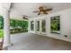 Covered back porch featuring white columns, ceiling fans, and a nice view of the backyard at 417 N Gurney St, Burlington, NC 27215