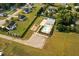 Aerial view of the community pool, playground, and surrounding homes at 44 Supreme Dr, Lillington, NC 27546