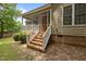 The home features a screened-in porch, brick foundation, and staircase access at 44 Supreme Dr, Lillington, NC 27546