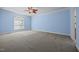 Expansive bedroom featuring new carpet, large window and neutral tones, ready for your personal touch at 44 Supreme Dr, Lillington, NC 27546