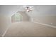 Spacious bonus room with carpet flooring, a ceiling fan, and a window providing natural light at 44 Supreme Dr, Lillington, NC 27546