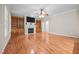 Spacious living room featuring hardwood floors, a fireplace, and elegant built-in shelves at 44 Supreme Dr, Lillington, NC 27546