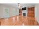 Spacious living room featuring a fireplace, built-in shelves, and lots of natural light at 44 Supreme Dr, Lillington, NC 27546