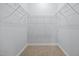 Spacious walk-in closet featuring carpet flooring and wire shelving at 44 Supreme Dr, Lillington, NC 27546