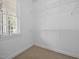 A walk-in closet featuring carpet flooring, wire shelving and a window for natural light at 44 Supreme Dr, Lillington, NC 27546
