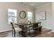 Dining room features modern decor, a wooden table with bench seating, and stylish flooring at 474 Carolina Springs Dr, Apex, NC 27539