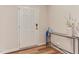 Inviting entryway features a stylish console table, white door, and wood-look flooring at 474 Carolina Springs Dr, Apex, NC 27539