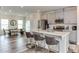 Modern kitchen boasts quartz countertops, stainless steel appliances, and seating at the island at 474 Carolina Springs Dr, Apex, NC 27539