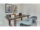 Well-lit office space featuring a long wooden desk and comfortable gray chairs at 474 Carolina Springs Dr, Apex, NC 27539