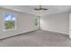 Spacious bedroom with large windows for natural light and neutral carpeting at 503 Bellmeade Bay Dr, Durham, NC 27703