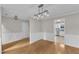 Spacious dining room features decorative wainscoting and a modern light fixture at 503 Bellmeade Bay Dr, Durham, NC 27703