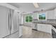 Bright kitchen features stainless steel appliances, granite countertops, and tile flooring at 503 Bellmeade Bay Dr, Durham, NC 27703
