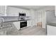 Bright, updated kitchen featuring stainless steel appliances, granite counters and ample cabinet space at 503 Bellmeade Bay Dr, Durham, NC 27703
