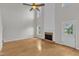 Spacious living room featuring hardwood floors, a fireplace, and lots of natural light at 503 Bellmeade Bay Dr, Durham, NC 27703