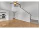 Open-concept living room with hardwood floors, stairs and a view of the kitchen at 503 Bellmeade Bay Dr, Durham, NC 27703