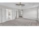 Large main bedroom with multiple doors and neutral carpeting at 503 Bellmeade Bay Dr, Durham, NC 27703