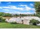 Scenic view of a pond surrounded by lush greenery and trees reflecting a blue sky at 503 Bellmeade Bay Dr, Durham, NC 27703