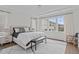 This bedroom boasts natural light with large windows, a comfy bed, and stylish furniture, creating a serene retreat at 520 Flip Trl, Cary, NC 27513