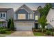 Charming two-story home featuring a two-car garage and well-maintained landscaping at 520 Flip Trl, Cary, NC 27513