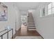Elegant foyer with hardwood floors, staircase, and ample natural light at 520 Flip Trl, Cary, NC 27513