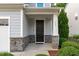 Welcoming front entrance with stone accents and a covered porch at 520 Flip Trl, Cary, NC 27513