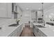 Spacious kitchen with stainless steel appliances, quartz countertops, and ample cabinet space at 520 Flip Trl, Cary, NC 27513