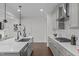 Open-concept kitchen with an island sink, modern stainless steel appliances, and granite countertops at 520 Flip Trl, Cary, NC 27513