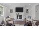 Inviting living room featuring a fireplace, comfortable seating, and modern decor at 520 Flip Trl, Cary, NC 27513