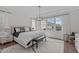 Bright primary bedroom with large windows, stylish furnishings, and hardwood floors at 520 Flip Trl, Cary, NC 27513