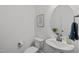 Cozy powder room with a stylish vanity, round mirror, and a framed botanical print on the wall at 520 Flip Trl, Cary, NC 27513
