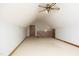 Large bonus room with neutral carpet, ceiling fan, and natural light at 5464 Bass Mountain Rd, Snow Camp, NC 27349