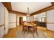 Elegant dining room with a round wooden table, braided rug, and classic trim at 5464 Bass Mountain Rd, Snow Camp, NC 27349