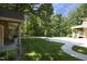 Wide driveway and inviting entryway leading to a home surrounded by mature trees at 5464 Bass Mountain Rd, Snow Camp, NC 27349