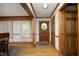 Foyer with beautiful wood floors and trim, leading to a charming entryway at 5464 Bass Mountain Rd, Snow Camp, NC 27349