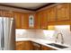 Bright kitchen with stainless steel appliances, subway tile backsplash, and gorgeous wooden cabinets at 5464 Bass Mountain Rd, Snow Camp, NC 27349
