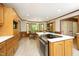 Spacious kitchen featuring an island with modern stovetop and an adjoining dining area at 5464 Bass Mountain Rd, Snow Camp, NC 27349