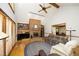 Inviting living room with a brick fireplace, built-in shelves, and high vaulted ceilings at 5464 Bass Mountain Rd, Snow Camp, NC 27349