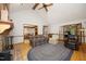 Spacious living room featuring a cozy seating area with a fireplace and open layout to dining room at 5464 Bass Mountain Rd, Snow Camp, NC 27349