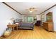 Spacious primary bedroom features hardwood floors, a ceiling fan and lots of natural light at 5464 Bass Mountain Rd, Snow Camp, NC 27349